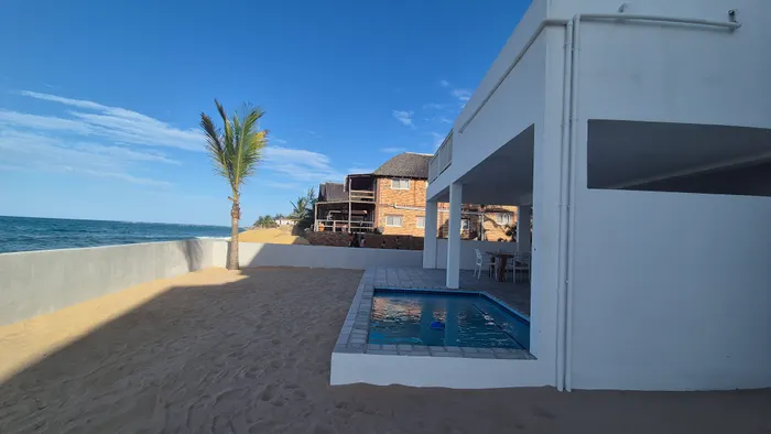 Sandy beach beside the Barra Cabanas beach house complex