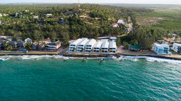 Aerial view over the Barra Cabanas property and the Indian Ocean shoreline