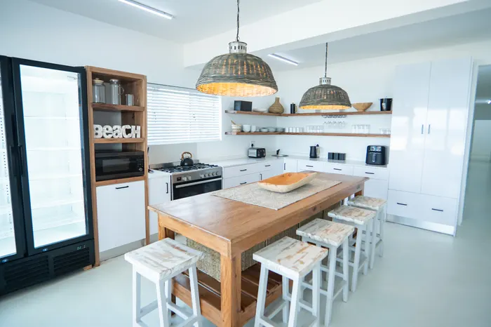 Living and dining area inside a Barra Cabanas beach house