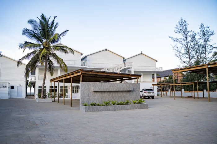 Beach bar and palm trees at the Barra Cabanas property