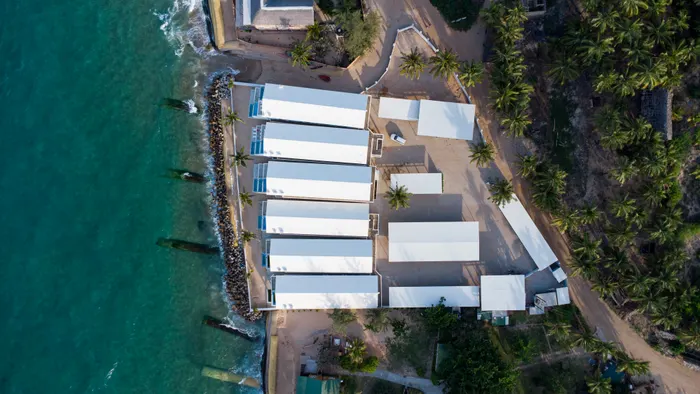 Overhead view of the Barra Cabanas beach house complex and its coastal setting