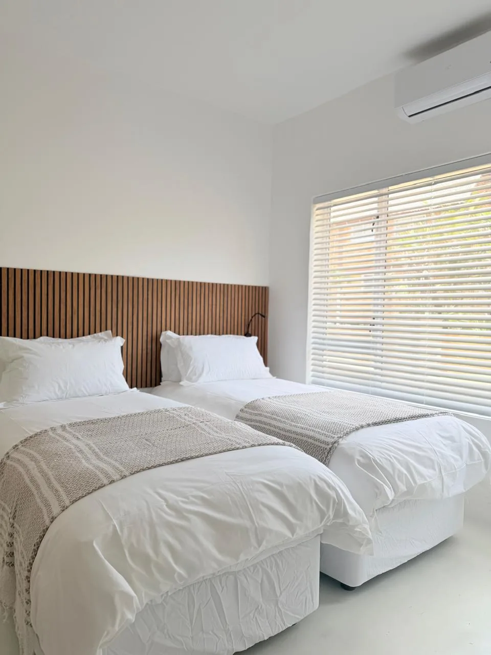 En-suite bedroom with air-conditioning and queen bed