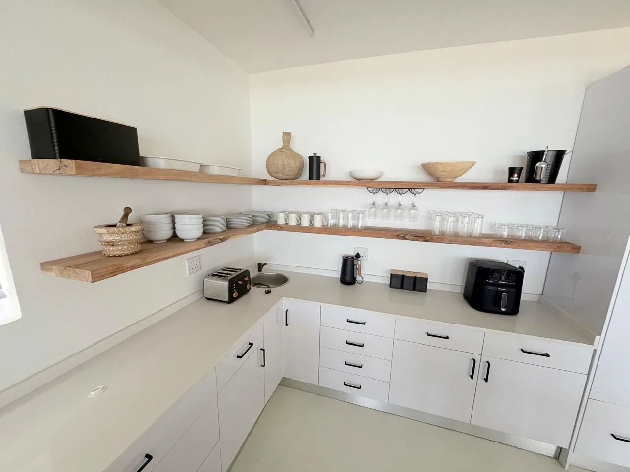 Fully equipped modern kitchen with gas stove and appliances